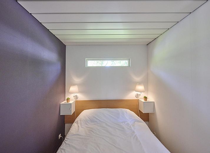 Gemuetliche Sitzecke mit Holzofen in Huisje Joep, gemuetliche Atmosphaere in Goedereede, Suedholland.