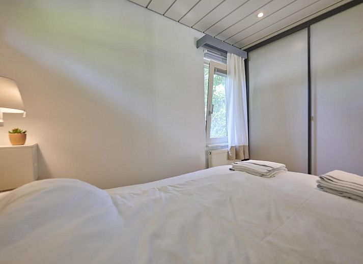 Gemuetliche Sitzecke mit Holzofen in Huisje Joep, gemuetliche Atmosphaere in Goedereede, Suedholland.