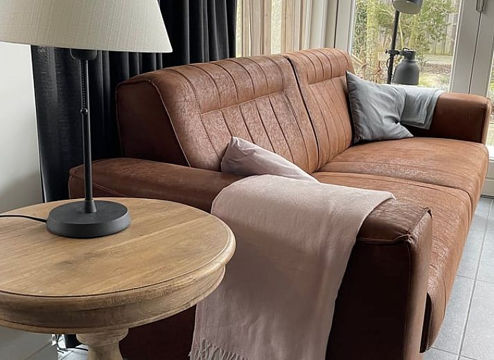 Flowering garden at Cottage in Dirksland vacation home in South Holland with colorful flowers.