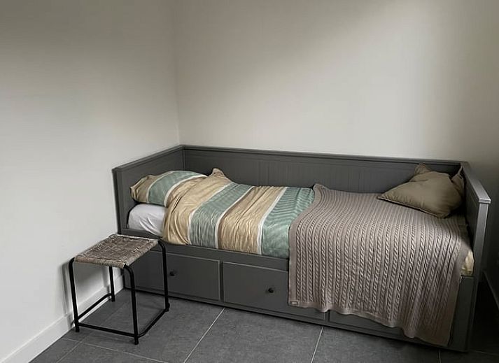 Cottage in Dirksland vacation home in Goeree-Overflakkee at dusk with atmospheric lighting.