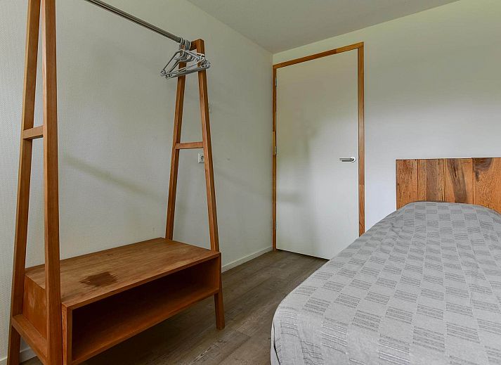 Modern living room of the Detached house in Reeuwijk, vacation home in South Holland with comfortable seating area and plenty of natural light.