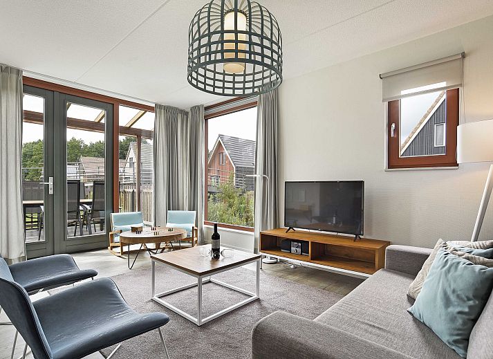 Comfortabele woonkamer in De Reeuwijkse Plassen 4-persoons kinderwoning, vakantiehuis in Reeuwijk.