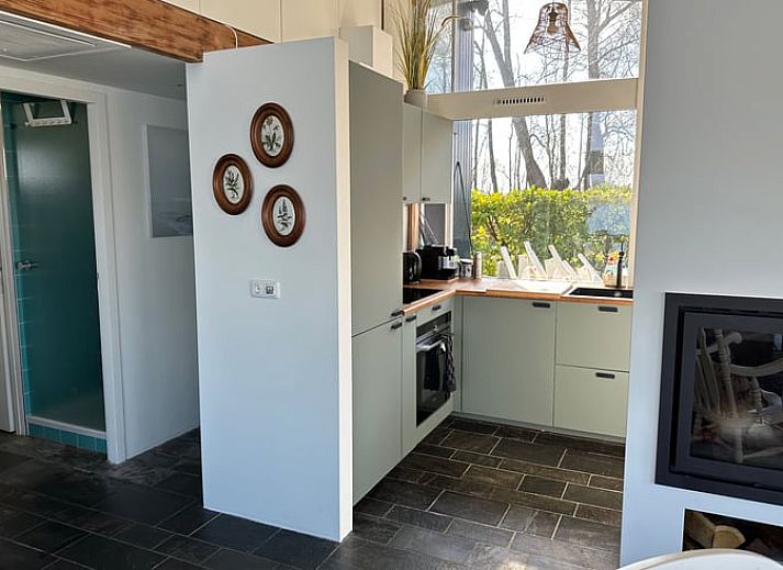 Cozy living room of Holiday home in Reeuwijk overlooking the water, ideally located in the Green Heart of South Holland.