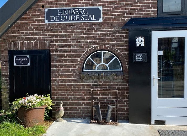 Cozy dining room in Holiday cottage in Leimuiden, Green Heart, South Holland with wooden table and leather chairs.
