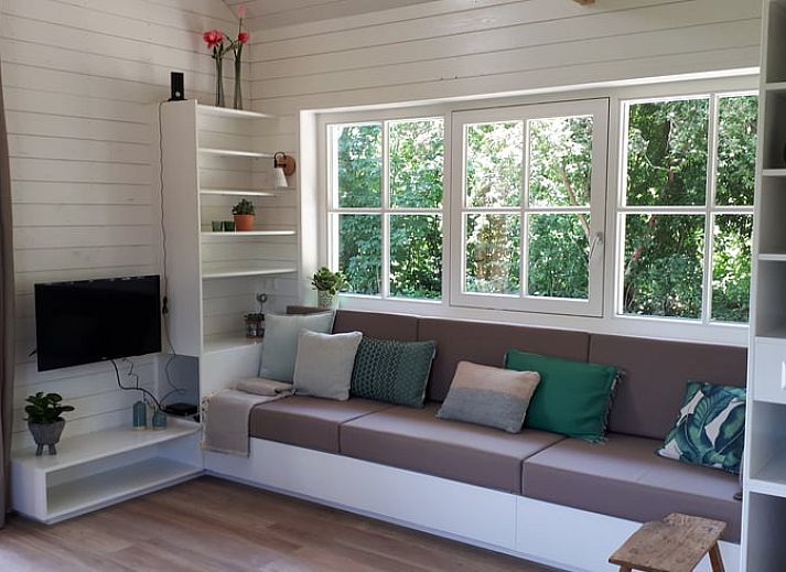 Vacation home in Hazerswoude-Rijndijk with wooden veranda and garden view, located in the Green Heart of South Holland.