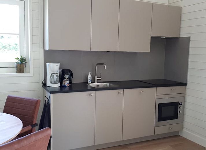 Cozy sleeping loft in Holiday home in Hazerswoude-Rijndijk, Green Heart, South Holland, with wooden interior and comfortable beds.