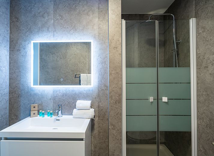 Dining area of Chalet in Noordwijk overlooking nature on the North Sea coast.