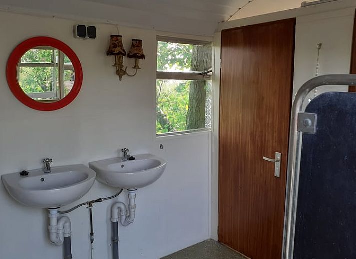 Attractive bedroom in Holiday Home in Simonshaven, South Holland with wooden walls and comfortable bed.