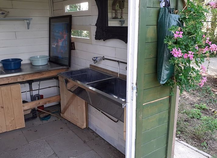 Attractive bedroom in Holiday Home in Simonshaven, South Holland with wooden walls and comfortable bed.