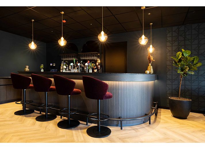 Spacious kitchen with dining table in Holiday Home Citta Romana, Hellevoetsluis, ideal for self-catering during your stay.