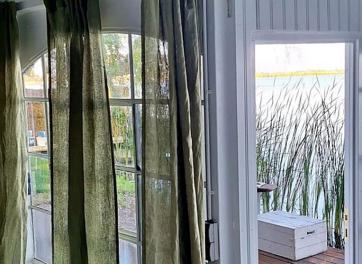 Veranda of House in Bleiswijk overlooking the water in Rotterdam, South Holland.