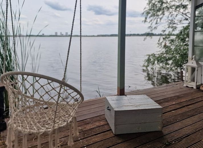 Veranda of House in Bleiswijk overlooking the water in Rotterdam, South Holland.