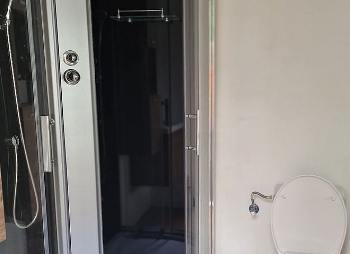 Interior space of Cottage in Bleiswijk with curtains and views of nature in Rotterdam, South Holland.