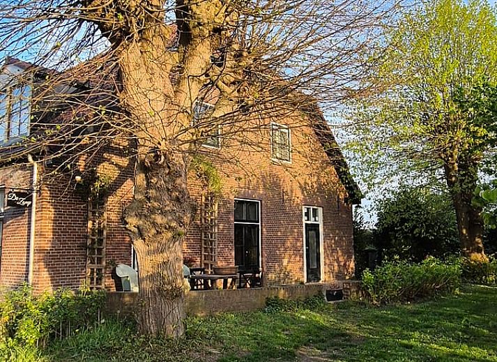 Comfortable bedroom with natural light in Cottage in Overasselt, ideal for a relaxing stay in Gelderland.