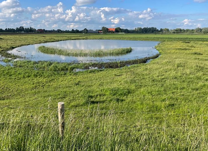 Seating area with view through to bedroom in Cottage in Erlecom, Gelderland.