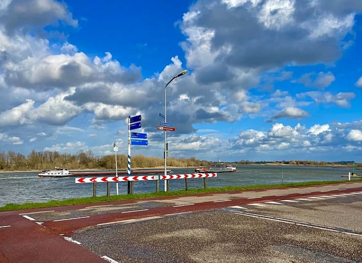Seating area with view through to bedroom in Cottage in Erlecom, Gelderland.