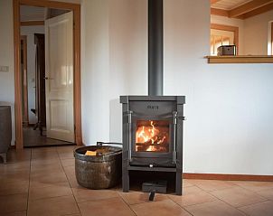 Holzofen im Velduil Ferienhaus De Cocksdorp Texel fr warme und gemtliche Abende.