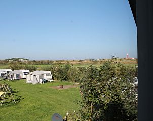 Panoramisch uitzicht vanuit Duin-/vuurtorenzicht vrijstaand vakantiehuis in De Cocksdorp, Texel met weids landschap.