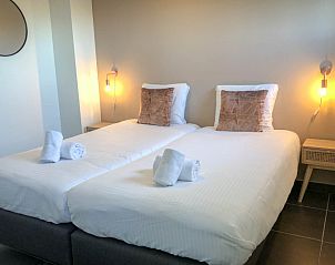 Komfortables Schlafzimmer mit Doppelbett im Ferienhaus De Vuurtoren in De Cocksdorp Texel.