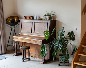 Mooie pianohoek in Vakantiehuis Paal 86, De Cocksdorp, Texel voor muzikale momenten.