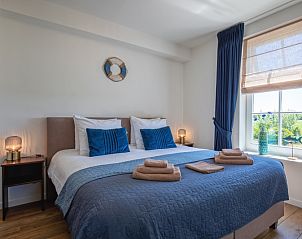 Comfortabele slaapkamer in Appartement A in De Cocksdorp Texel met luxe beddengoed.