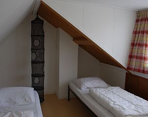 Mansardenzimmer mit schrger Wand in der Kikkertstraat 067, Ferienhaus in De Cocksdorp, Texel.
