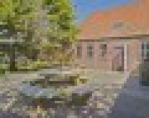 Buitenterras van de Oorsprong, vakantiehuis De Cocksdorp Texel, ideaal voor ontspanning in de zon.