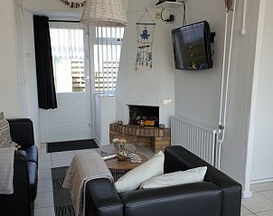Sitzecke am Kamin im Ferienhaus Familie Bouthoorn, Zuid-Eierland, Texel zur Entspannung.