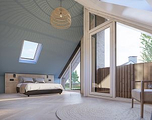 Lichte slaapkamer van Chalet in De Cocksdorp met dakramen, Texel, Waddeneilanden.