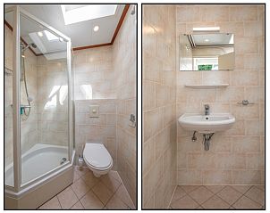 Moderne badkamer in Bungalow Tamarisk 196, De Cocksdorp, Texel, met douchecabine en wastafel.