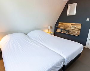 Sfeervolle slaapkamer in Frederik en Lodevika vakantiehuis, De Cocksdorp, Texel, Waddeneilanden.