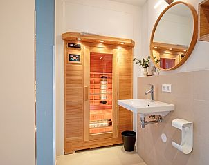 Wellness area with sauna in Holiday home De Razende Bol, De Cocksdorp, Texel, for ultimate relaxation.