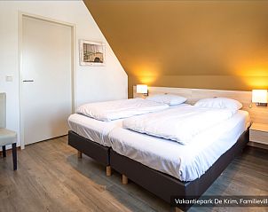 Gezellige slaapkamer in Familievilla 16 persoons, De Cocksdorp, Texel met comfortabele bedden.