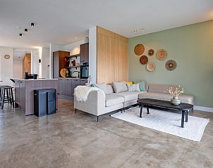 Offener Wohnbereich im Ferienhaus Griend, Texel mit Kche und Sitzecke.