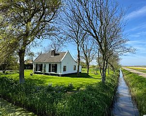 Paal 91 Texel vakantiehuis in De Cocksdorp, omringd door groen en rust op Texel, Waddeneilanden.