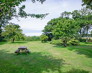 Terras met zitgelegenheid bij Paal 91 Texel vakantiehuis in De Cocksdorp, perfect voor ontspanning op Texel.