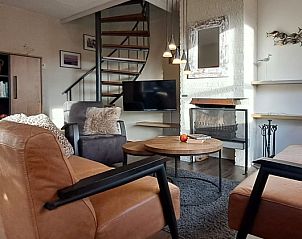 Gezellige woonkamer in Villapark Residentie Texel nr. 577, vakantiehuis in De Cocksdorp, Texel met moderne inrichting en ruime zithoek.