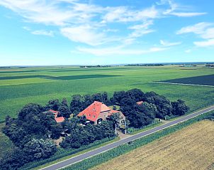Luchtfoto van Vakantiehuis in De Cocksdorp, gelegen te midden van Texelse natuur.