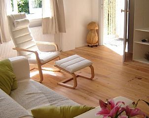 Bright living room in Cottage in De Cocksdorp, vacation home on Texel, Wadden Islands, with comfortable furnishings.