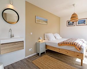 Comfortabele slaapkamer in Vakantiehuis Slufteroord 292, Bungalowpark Slufteroord, De Cocksdorp, Texel, met moderne inrichting.