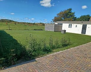 Geniet van de rust en groene omgeving bij Chalet Duunzicht, een vakantiehuis in De Cocksdorp, Texel, met uitzicht op de Waddeneilanden.
