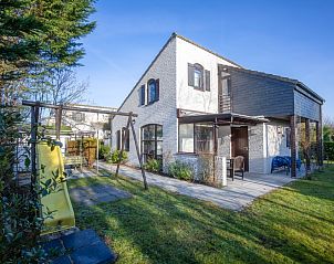 Villapark Residentie Texel nr. 463, een charmant vakantiehuis in De Cocksdorp, Texel, omgeven door groene natuur en rustgevende omgeving.