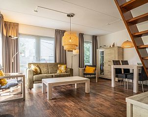 Cozy living room of Holiday home B 295 in De Cocksdorp, Texel. Spacious interior space with modern furnishings on the Wadden Islands.