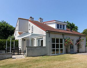 Vacation home D 740 in De Cocksdorp, Texel offers a charming terrace and green surroundings for a relaxing stay on the Wadden Islands.