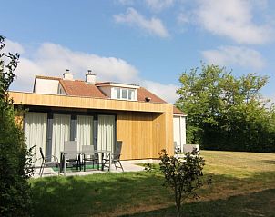 Enjoy the terrace of Holiday home D 449 in De Cocksdorp, Texel, surrounded by green nature on the Wadden Islands.