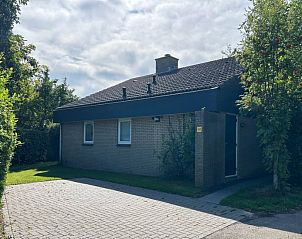 Vakantiehuis A 343 in De Cocksdorp, Texel, biedt een serene buitenaanblik met omringende natuur op de Waddeneilanden.