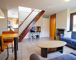 Cozy living room in Holiday home B 195, De Cocksdorp, Texel with comfortable seating area and modern decor on the Wadden Islands.