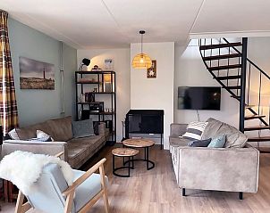 Gezellige woonkamer van Vakantiehuis D 709 in De Cocksdorp, Texel. Comfortabele zitruimte met moderne inrichting op de Waddeneilanden.