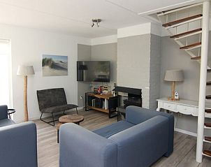 Gezellige woonkamer van Vakantiehuis D 710 in De Cocksdorp, Texel. Comfortabele zitruimte met moderne inrichting op de Waddeneilanden.