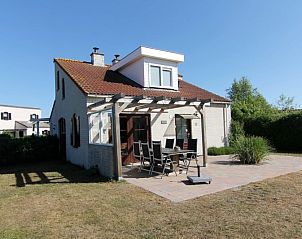 Ferienhaus D 401 in De Cocksdorp, Texel mit sonniger Terrasse und grner Umgebung, ideal fr Entspannung auf den Watteninseln.